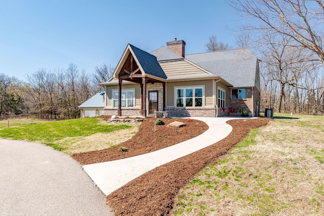 8900 W Graham Rd, Rocheport, MO 65279 - craftsman house with brick siding, a chimney, and a shingled roof