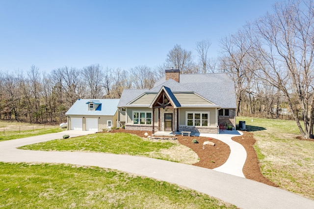8900 W Graham Rd, Rocheport, MO 65279 - bungalow-style home featuring driveway, a chimney, a front yard, a garage, and roof with shingles