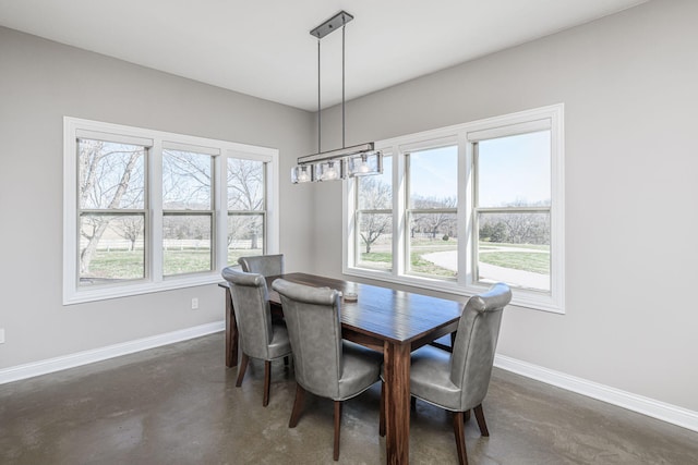 8900 W Graham Rd, Rocheport, MO 65279 - dining area with finished concrete floors and a chandelier