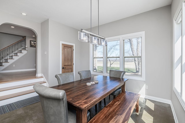 8900 W Graham Rd, Rocheport, MO 65279 - dining area featuring stairs, arched walkways, and recessed lighting