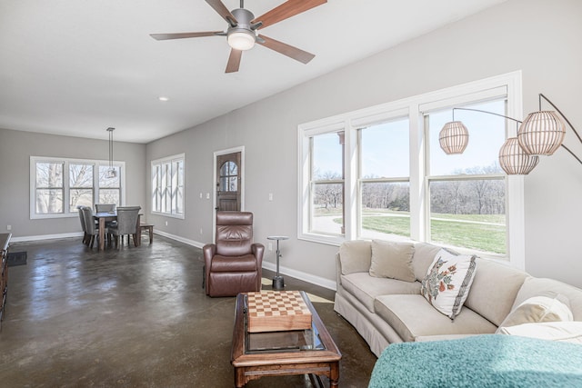 8900 W Graham Rd, Rocheport, MO 65279 - living room with concrete flooring and ceiling fan