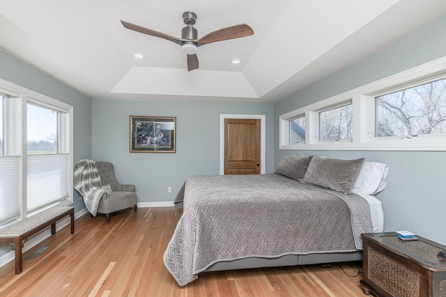 8900 W Graham Rd, Rocheport, MO 65279 - bedroom with a tray ceiling, light wood-type flooring, recessed lighting, and a ceiling fan