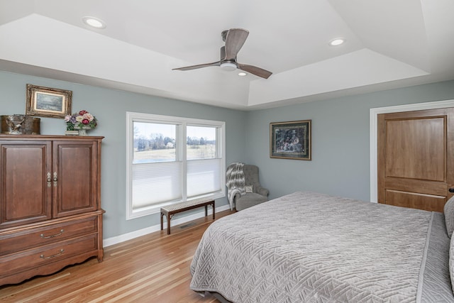 8900 W Graham Rd, Rocheport, MO 65279 - bedroom featuring a raised ceiling, recessed lighting, light wood finished floors, and ceiling fan