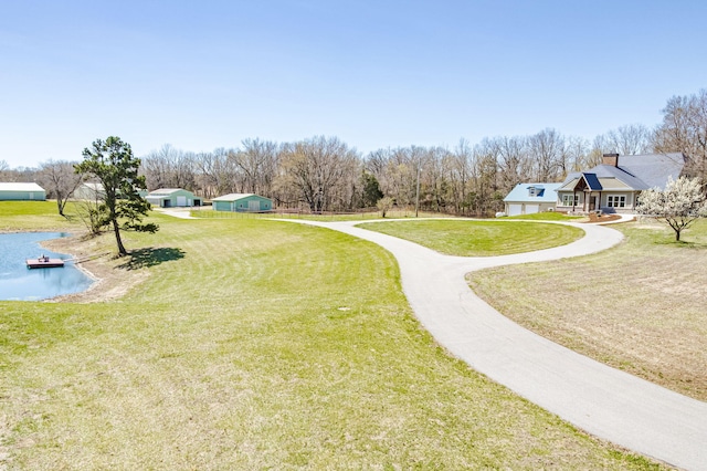 8900 W Graham Rd, Rocheport, MO 65279 - view of property's community with a lawn, driveway, and a water view