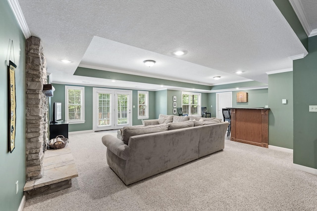 1707 Brookfield Mnr, Columbia, MO 65203 - living room with crown molding, a textured ceiling, carpet flooring, a tray ceiling, and recessed lighting