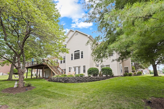 1707 Brookfield Mnr, Columbia, MO 65203 - back of property with a deck, stairs, and a yard