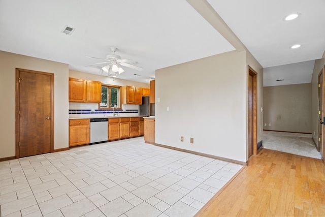2002 Chapel Hill Rd, Columbia, MO 65203 - kitchen featuring appliances with stainless steel finishes, light countertops, a ceiling fan, brown cabinetry, and recessed lighting