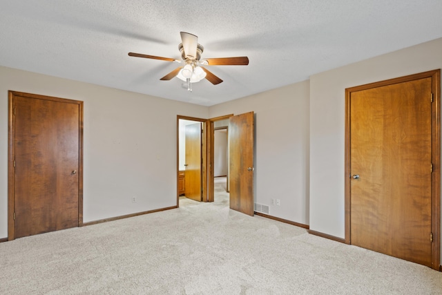 2002 Chapel Hill Rd, Columbia, MO 65203 - unfurnished bedroom featuring carpet flooring and a ceiling fan