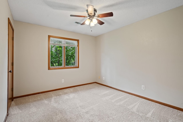 2002 Chapel Hill Rd, Columbia, MO 65203 - carpeted spare room with a ceiling fan and a textured ceiling