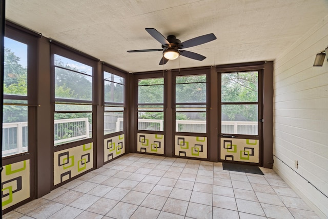 2002 Chapel Hill Rd, Columbia, MO 65203 - unfurnished sunroom with a ceiling fan and tile patterned floors