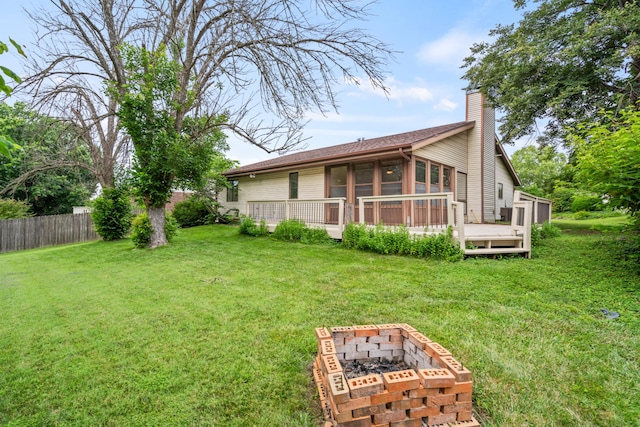 2002 Chapel Hill Rd, Columbia, MO 65203 - rear view of property with an outdoor fire pit, a chimney, and a wooden deck