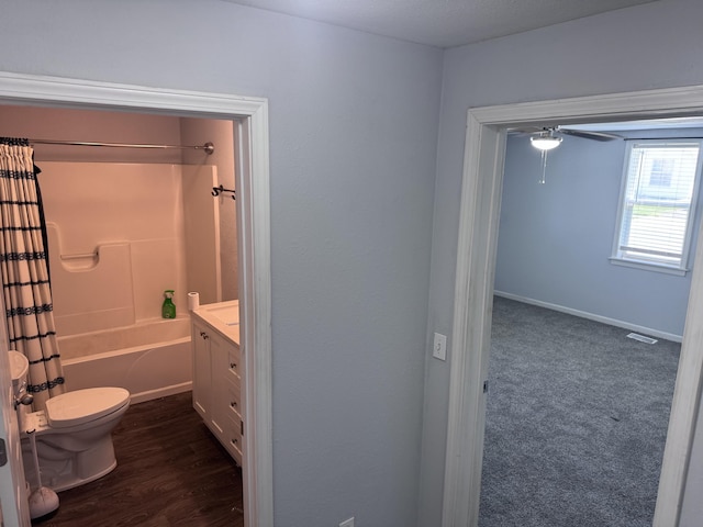 809 S 4th St, Moberly, MO 65259 - full bathroom with vanity, shower / bath combination with curtain, wood finished floors, and ceiling fan