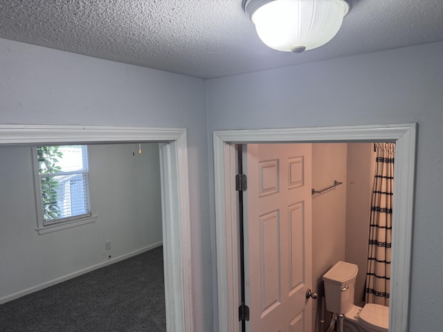 809 S 4th St, Moberly, MO 65259 - bathroom featuring toilet and a textured ceiling