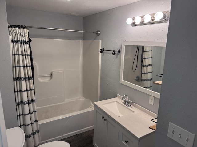 809 S 4th St, Moberly, MO 65259 - bathroom with a textured wall, vanity, shower / tub combo, and wood finished floors