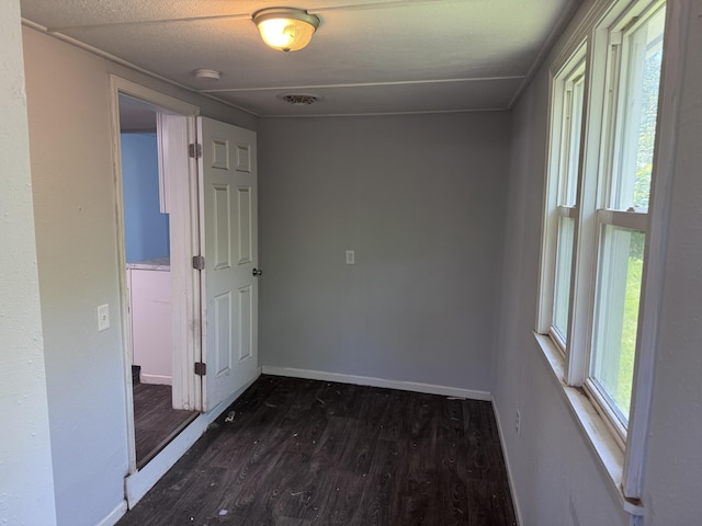 809 S 4th St, Moberly, MO 65259 - spare room with a smoke detector and dark wood finished floors