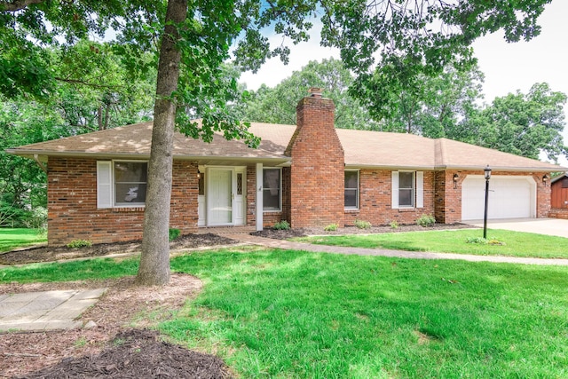 1745 Engelwood Dr, Jefferson City, MO 65101 - ranch-style house featuring an attached garage, a front yard, a chimney, brick siding, and driveway