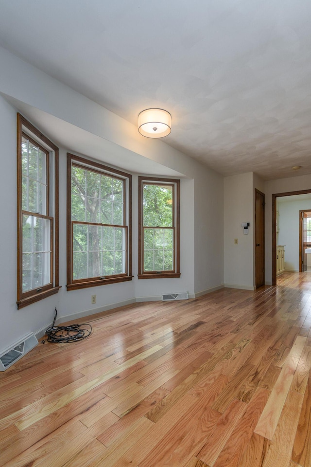1745 Engelwood Dr, Jefferson City, MO 65101 - unfurnished room featuring plenty of natural light and light wood-style floors