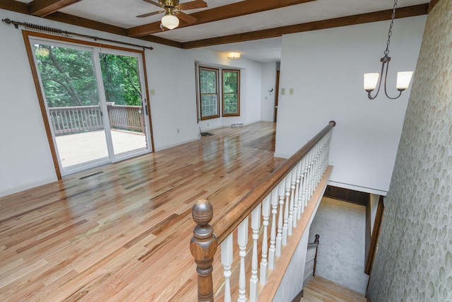 1745 Engelwood Dr, Jefferson City, MO 65101 - staircase with beamed ceiling, a ceiling fan, wood finished floors, and a chandelier