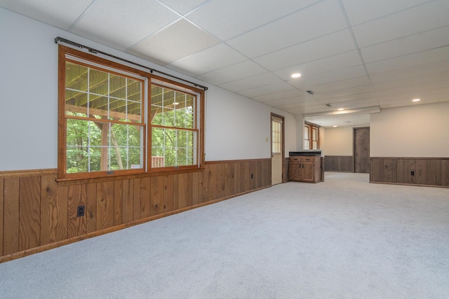 1745 Engelwood Dr, Jefferson City, MO 65101 - carpeted empty room featuring wainscoting, wood walls, plenty of natural light, a drop ceiling, and recessed lighting