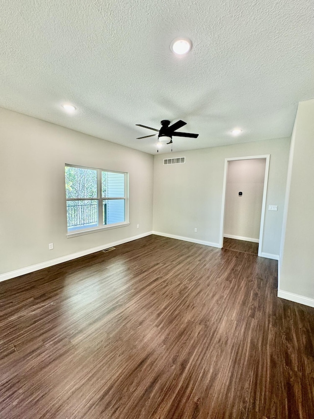 1680 W Fenton Rd, Columbia, MO 65202 - unfurnished room featuring dark wood-style floors, a textured ceiling, a ceiling fan, and recessed lighting
