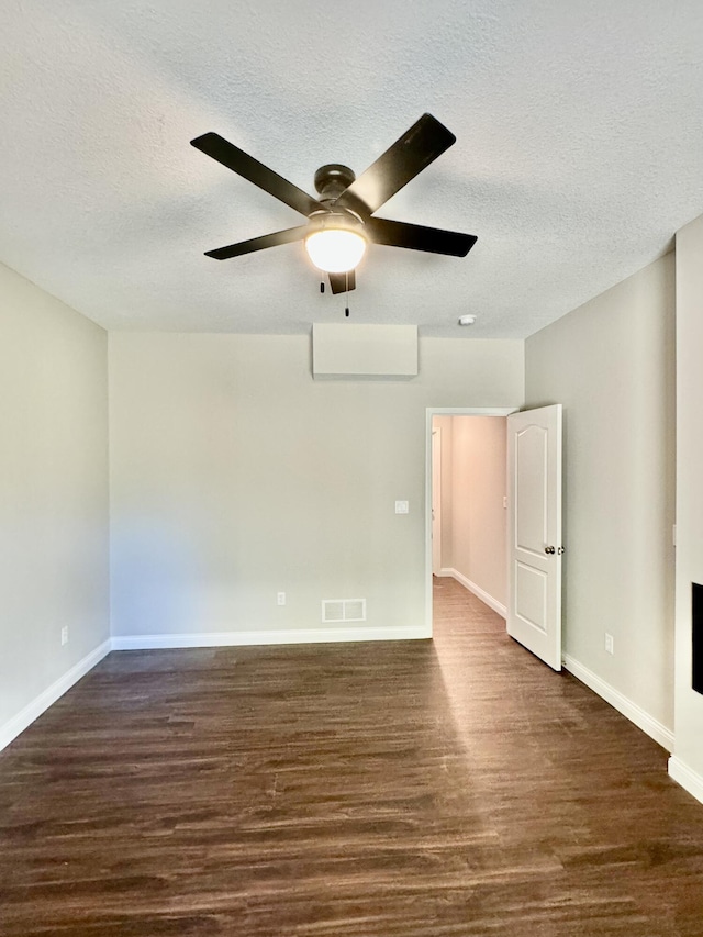 1680 W Fenton Rd, Columbia, MO 65202 - empty room featuring dark wood-type flooring, a textured ceiling, and a ceiling fan