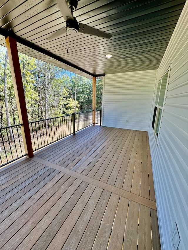 1680 W Fenton Rd, Columbia, MO 65202 - wooden deck with ceiling fan and view of wooded area