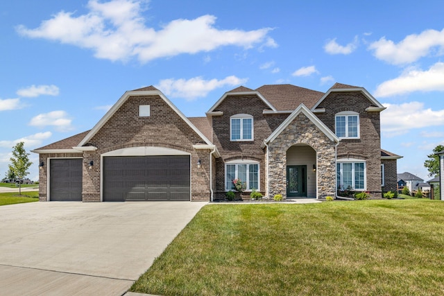 2821 Clopton Ct, Columbia, MO 65203 - view of front facade with a garage, a front yard, concrete driveway, brick siding, and a shingled roof