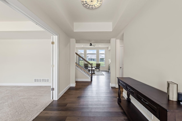 2821 Clopton Ct, Columbia, MO 65203 - hall featuring stairs, dark wood finished floors, and a raised ceiling