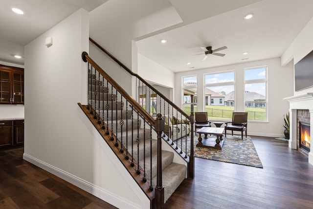 2821 Clopton Ct, Columbia, MO 65203 - stairway with a glass covered fireplace, ceiling fan, wood finished floors, and recessed lighting