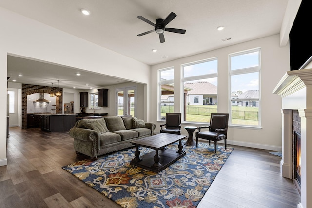 2821 Clopton Ct, Columbia, MO 65203 - living room with a ceiling fan, a fireplace, dark wood-type flooring, and recessed lighting