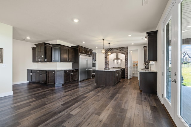 2821 Clopton Ct, Columbia, MO 65203 - kitchen with stainless steel appliances, dark wood-style floors, dark brown cabinets, a kitchen island, and recessed lighting