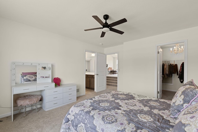 2821 Clopton Ct, Columbia, MO 65203 - bedroom featuring light carpet, a chandelier, a spacious closet, ceiling fan, and connected bathroom