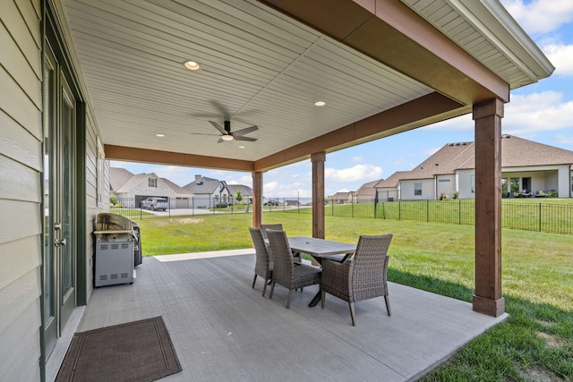 2821 Clopton Ct, Columbia, MO 65203 - fenced backyard with outdoor dining space, a patio, a ceiling fan, and a residential view