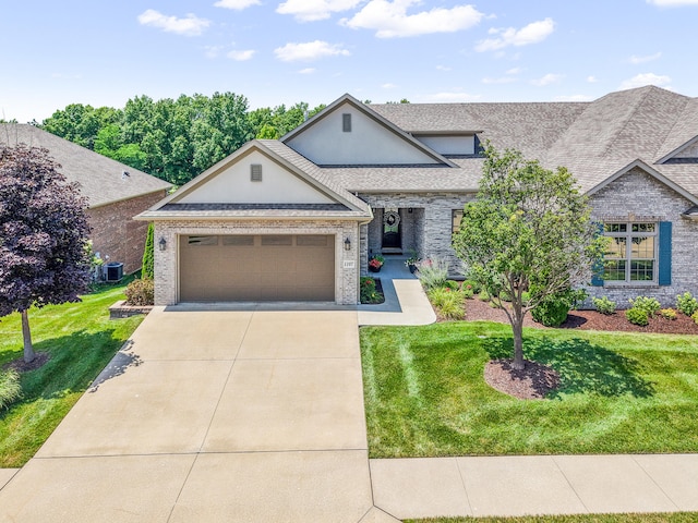 1107 Marcassin Dr, Columbia, MO 65201 - view of front of property featuring concrete driveway, a front lawn, an attached garage, and brick siding