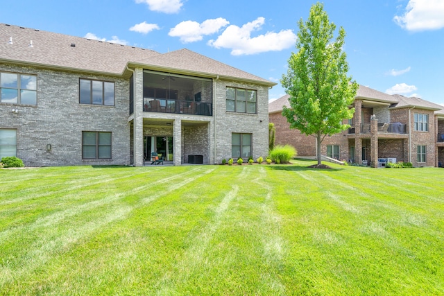 1107 Marcassin Dr, Columbia, MO 65201 - back of property with a balcony and a lawn