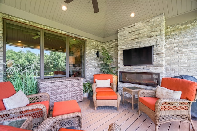 1107 Marcassin Dr, Columbia, MO 65201 - deck with a ceiling fan and an outdoor living space with a fireplace