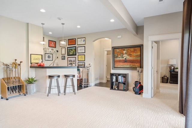 1107 Marcassin Dr, Columbia, MO 65201 - carpeted living room with arched walkways, recessed lighting, and a dry bar