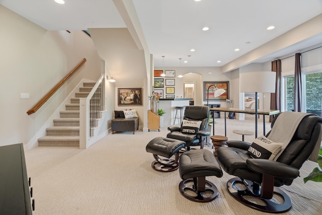 1107 Marcassin Dr, Columbia, MO 65201 - sitting room with arched walkways, carpet, stairs, and recessed lighting