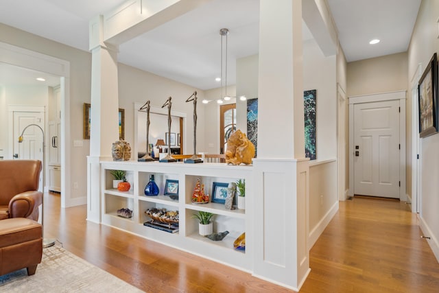 1107 Marcassin Dr, Columbia, MO 65201 - hall with wood finished floors, recessed lighting, and ornate columns