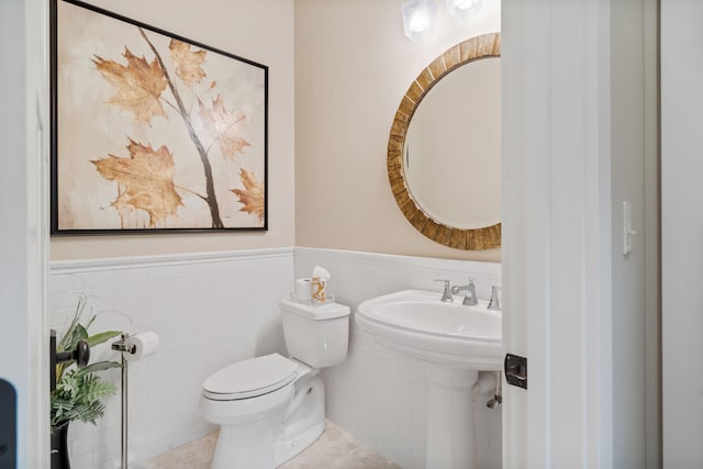 1107 Marcassin Dr, Columbia, MO 65201 - half bath featuring wainscoting and tile patterned floors