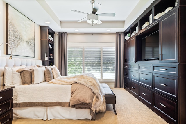 1107 Marcassin Dr, Columbia, MO 65201 - bedroom featuring light carpet, recessed lighting, a tray ceiling, and a ceiling fan