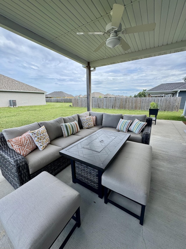 921 S Columbia St, Centralia, MO 65240 - fenced backyard with an outdoor hangout area and a ceiling fan