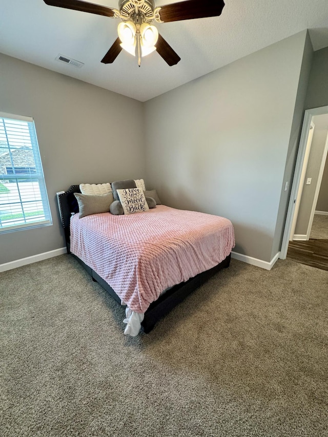 921 S Columbia St, Centralia, MO 65240 - carpeted bedroom with baseboards and a ceiling fan