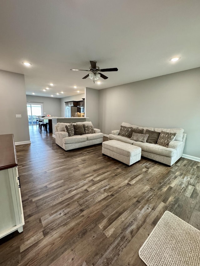 921 S Columbia St, Centralia, MO 65240 - living area featuring dark wood-style floors, recessed lighting, and a ceiling fan