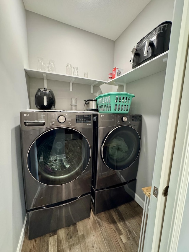 921 S Columbia St, Centralia, MO 65240 - laundry room featuring wood finished floors and washer and dryer