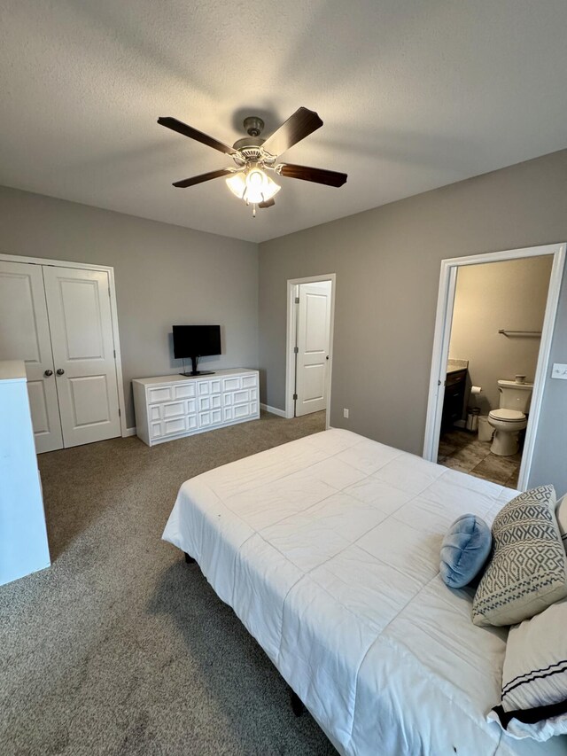 921 S Columbia St, Centralia, MO 65240 - carpeted bedroom featuring connected bathroom and a ceiling fan