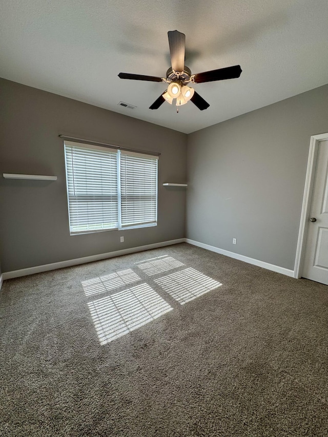 921 S Columbia St, Centralia, MO 65240 - spare room featuring ceiling fan and carpet flooring