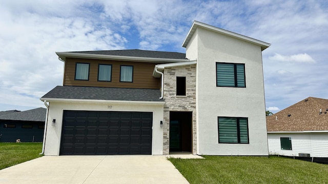717 Angels Rest Way, Columbia, MO 65203 - contemporary home featuring driveway, stone siding, a front yard, and a garage