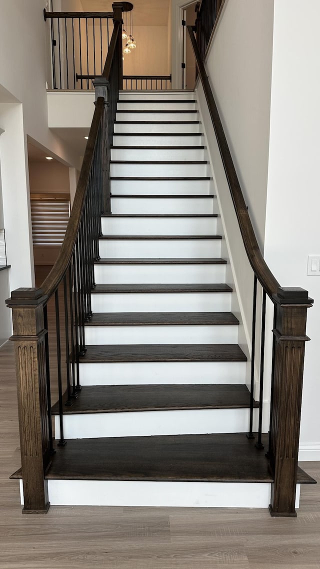 717 Angels Rest Way, Columbia, MO 65203 - staircase featuring wood finished floors and a high ceiling