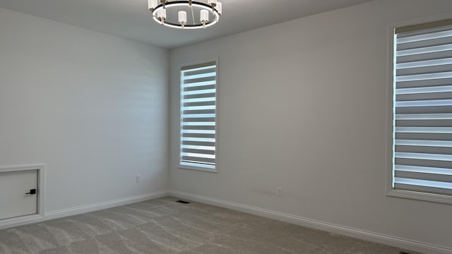 717 Angels Rest Way, Columbia, MO 65203 - spare room with a chandelier and carpet flooring
